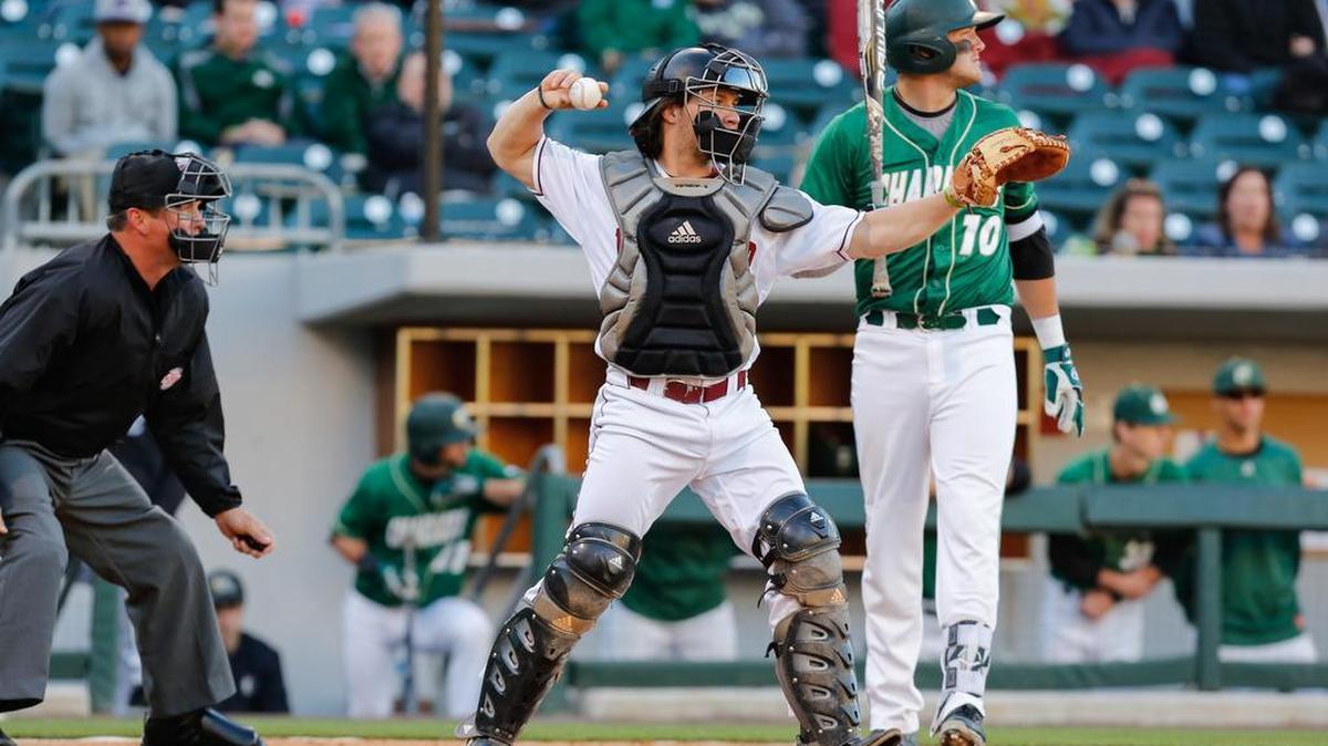 Winthrop catcher Roger Gonzalez holds the runner at first base as Winthrop faced Charlotte recently at BB&T BallPark.