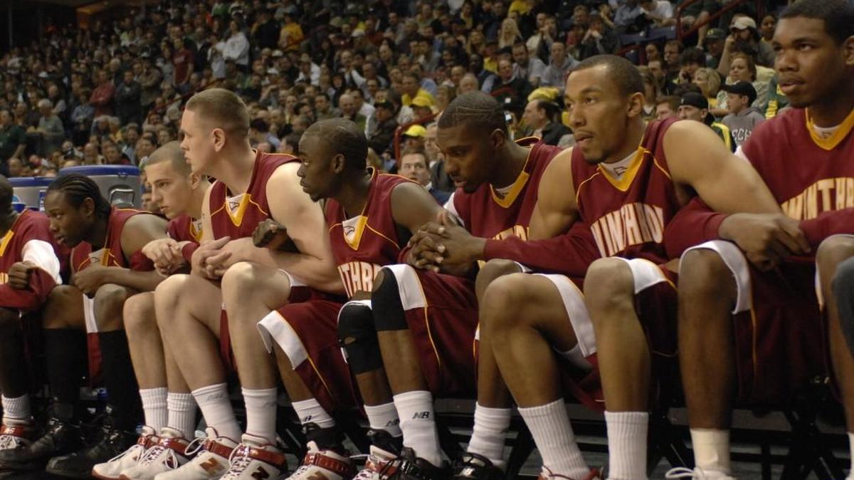 Winthrop players clasp hands during the final moments of the Eagles’ 2007 NCAA Tournament win over Notre Dame.