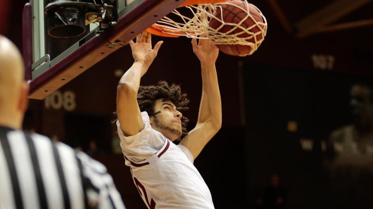Winthrop's No. 12 Xavier Cooks finishes to the rim as Winthrop hosts High Point in Big South basketball, 1-14-2016.
