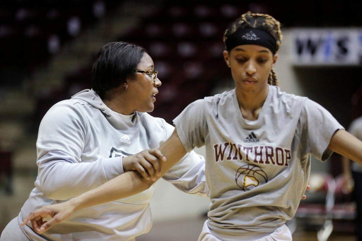 Withrop women’s basketball coach Semeka Randall Lay works with Frances Brown during a practice. The team will play Wednesday in the conference tournament.