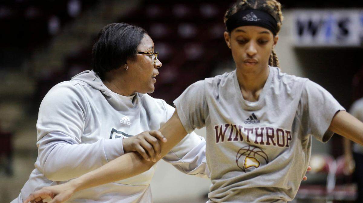 Withrop women’s basketball coach Semeka Randall Lay works with Frances Brown during a practice. The team will play Wednesday in the conference tournament.