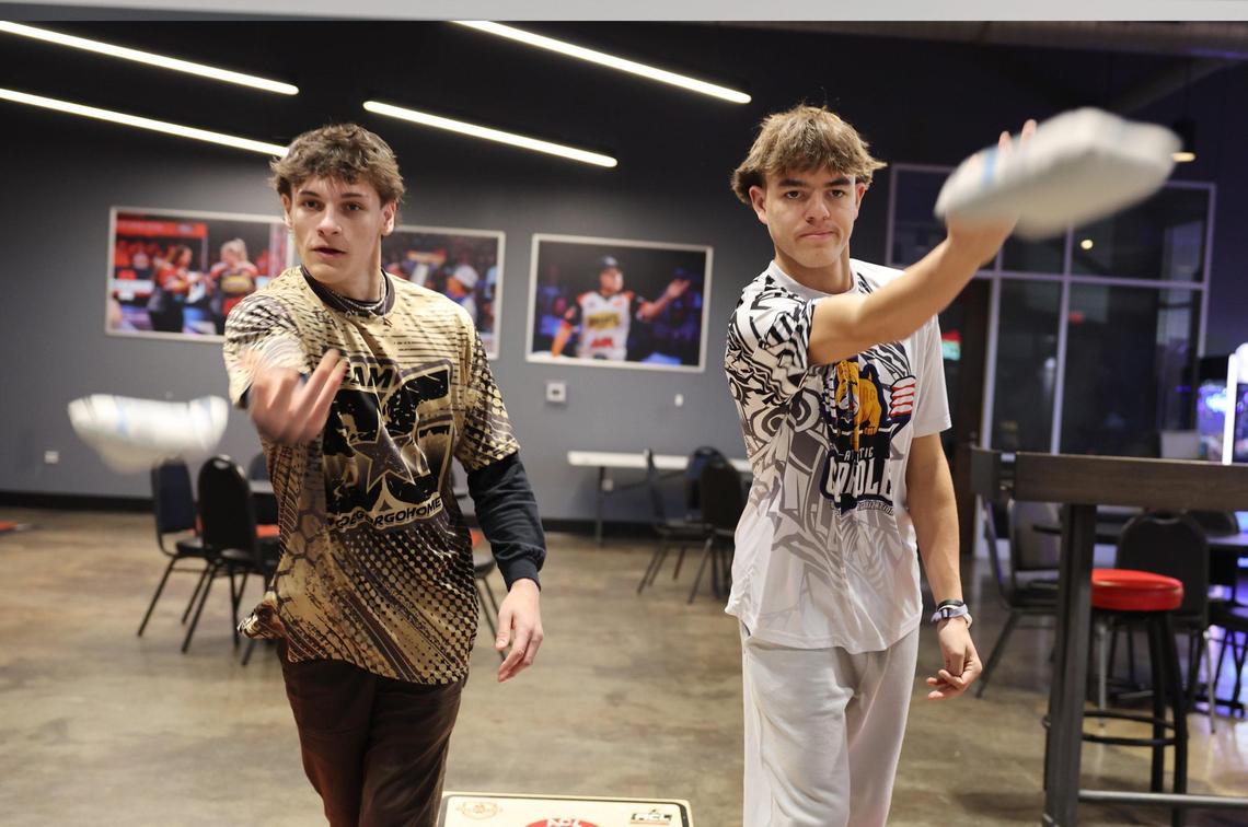 From left, Jaxson Remmick, Josh Quinn and Luke Bryant all play cornhole for Winthrop University in Rock Hill, S.C.