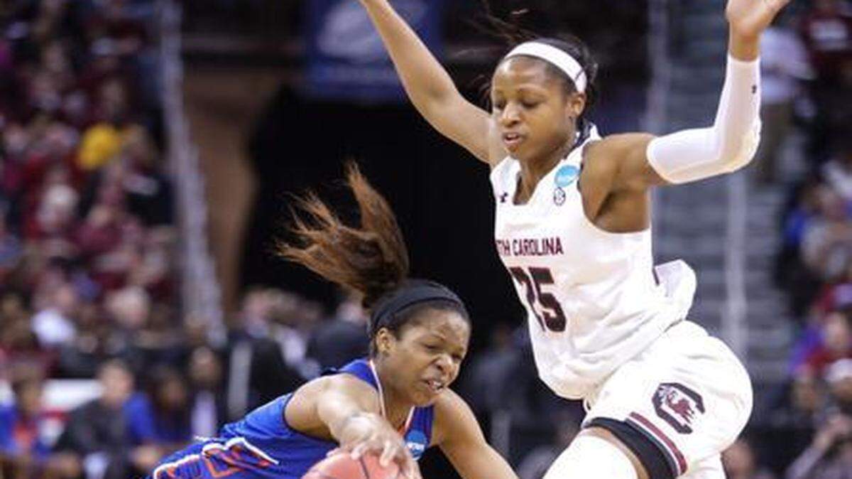 
Savannah State’s guard Jasmine Norman loses control of the ball after running into South Carolina’s guard Tiffany Mitchell. South Carolina won, 81-48. 
