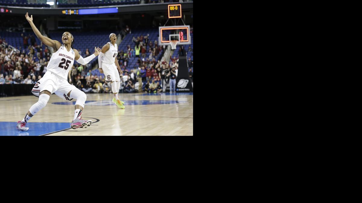 
South Carolina’s Tiffany Mitchell (25) and Alaina Coates (41) react after defeating Florida State in the regional final game in the NCAA Tournament in Greensboro, N.C., Sunday.
