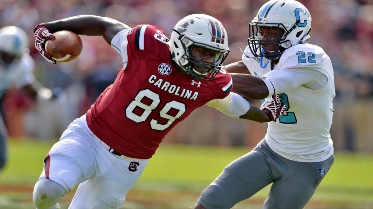 South Carolina's Jerell Adams runs out of the tackle attempt of by Citadel's Dondray Copeland Saturday in Columbia.