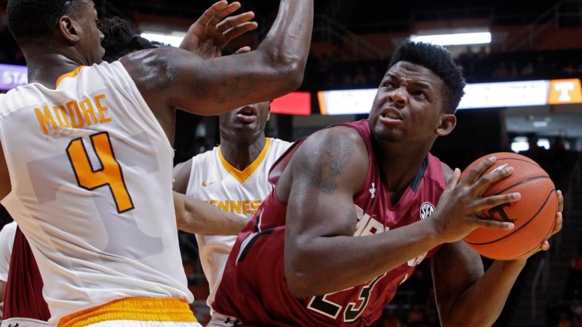 South Carolina forward Eric Cobb looks to shoot as he is pressured by Tennessee forward Armani Moore during the first half of Saturday’s game.