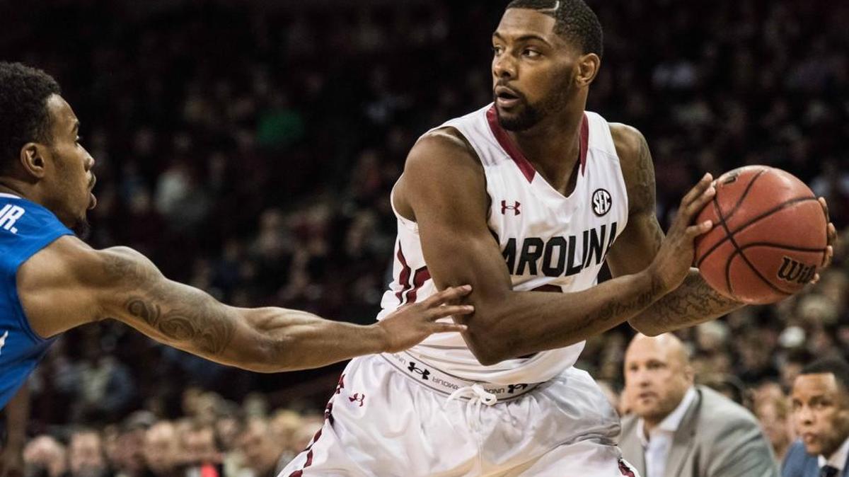 South Carolina guard Sindarius Thornwell, right, looks for an open lane against Memphis guard Ricky Tarrant Jr., left, during the first half Saturday.
