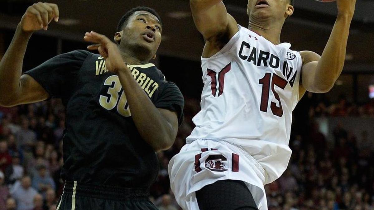 PJ Dozier of the South Carolina Gamecocks shoots over Damian Jones of the Vanderbilt Commodores Saturday. South Carolina. South Carolina won 69-65 to remain undefeated on the season.