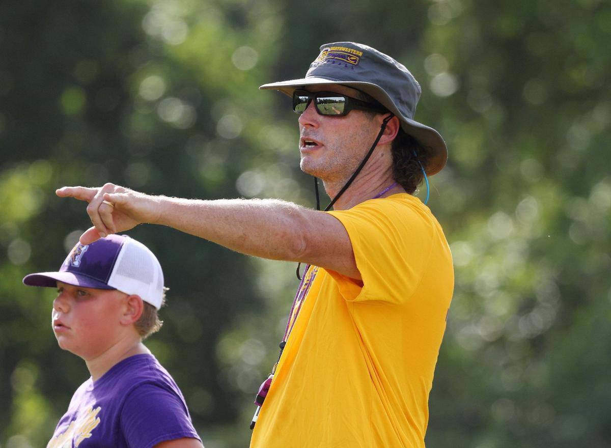 Northwestern varsity football head coach Page Wofford coaches his team during practice on Friday