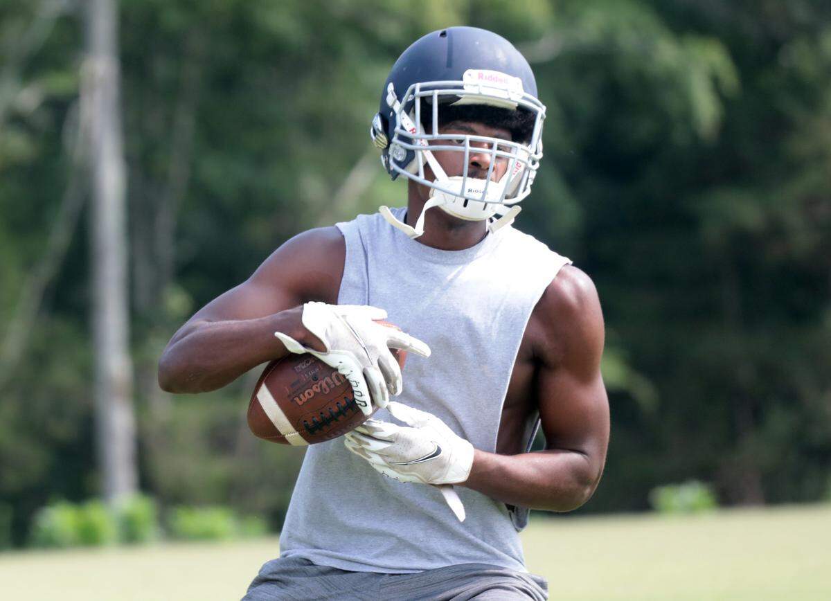 Legion football player Charles Green practices at Legion Collegiate.