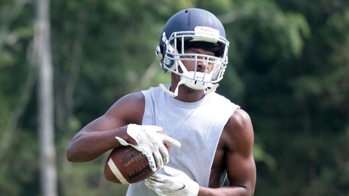 Legion football player Charles Green practices at Legion Collegiate.