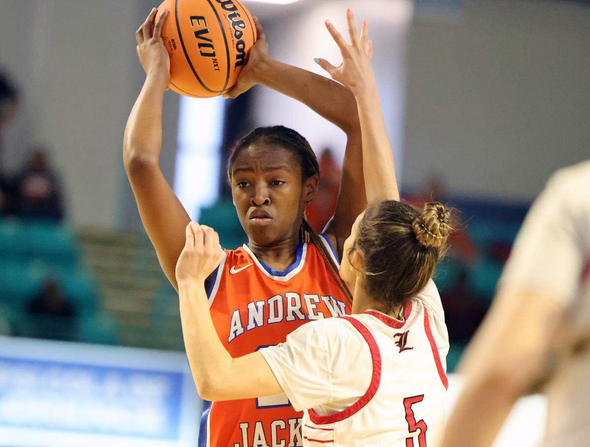 Andrew Jackson’s Tamia Watkins looks for an opening around Landrum’s Kaylee Cortez.