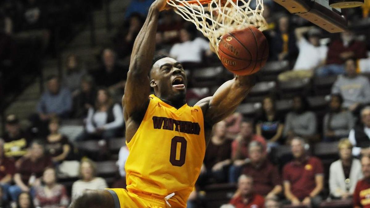 Winthrop's Duby Okeke dunks the ball. The Winthrop Eagles defeated the UNC Asheville Bulldogs 76-73 Thursday.