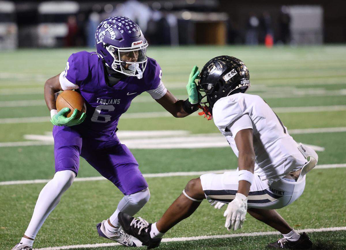 Northwestern’s Daniel Caldwell pushes back on Gaffney’s Jayden Sims Friday as the Trojans and Indians compete in Rock Hill.