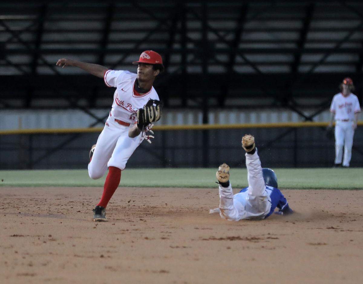 Indian Land’s Alex Blanchette slides into second base as South Pointe’s Jayce LeFlore catches the ball.