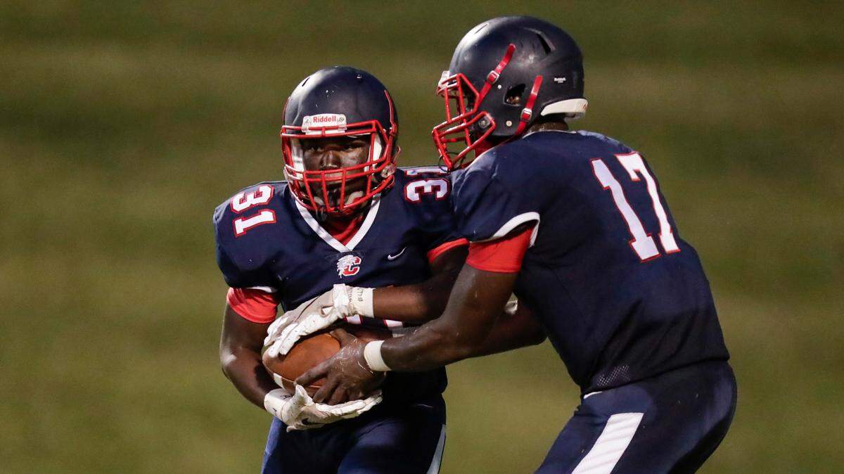 Chester quarterback (17) Zan Dunham hands off to Chester’s (31) Shydem McCullough in first half play as Chester hosts Northwestern in Friday night football 9-10-2021. The Cyclones play familiar foe Daniel for the 3A Upper State title on Friday in Central.