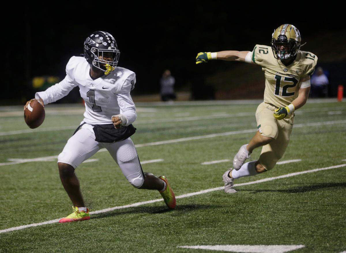 York’s Ayden Davis (1) looks for an opening as Catawba Ridge’s Evan Hamilton (12) follows Friday, Oct. 7, 2022 in Fort Mill.