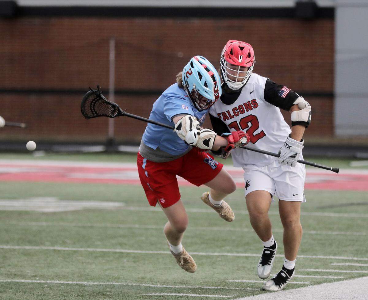Nation Ford’s Callan Sobas (12) and J.L. Mann’s David Greer.