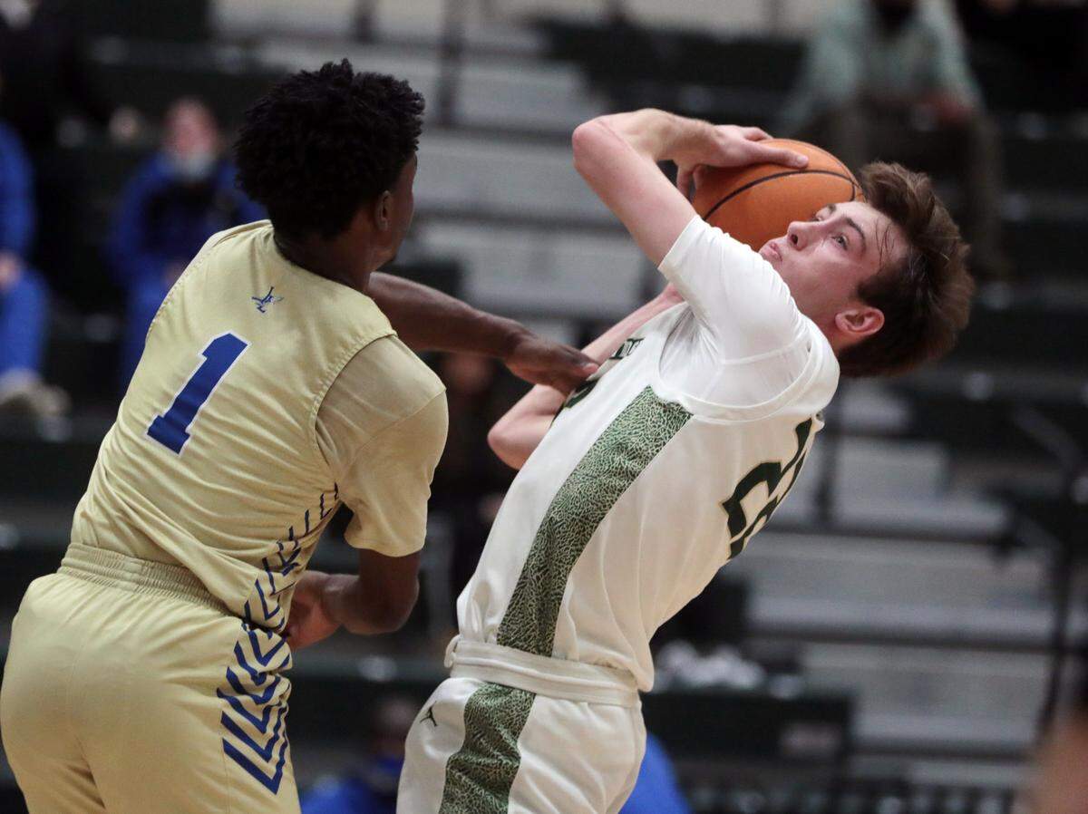 Indian Land’s John Fosu (1) puts pressure on Catawba Ridge’s Grant Lovette.