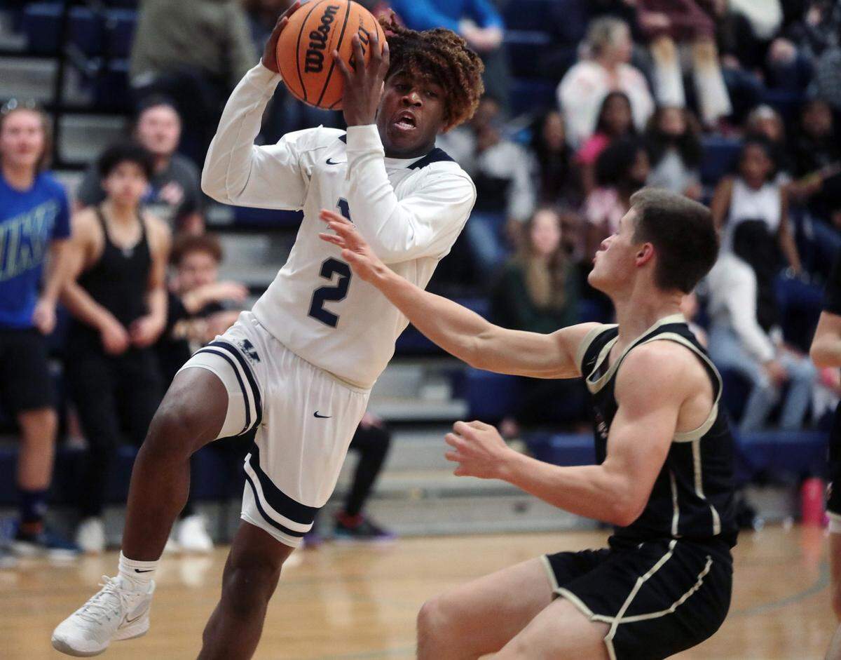 York Prep’s Kory Davis heads for the basket against Buford’s Brody Sanders.