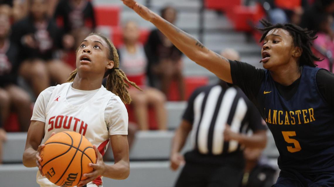 South Pointe’s Kaleigh Lucas heads to the basket around Lancaster’s Eliza Baskins Tuesday in Rock Hill, S.C.