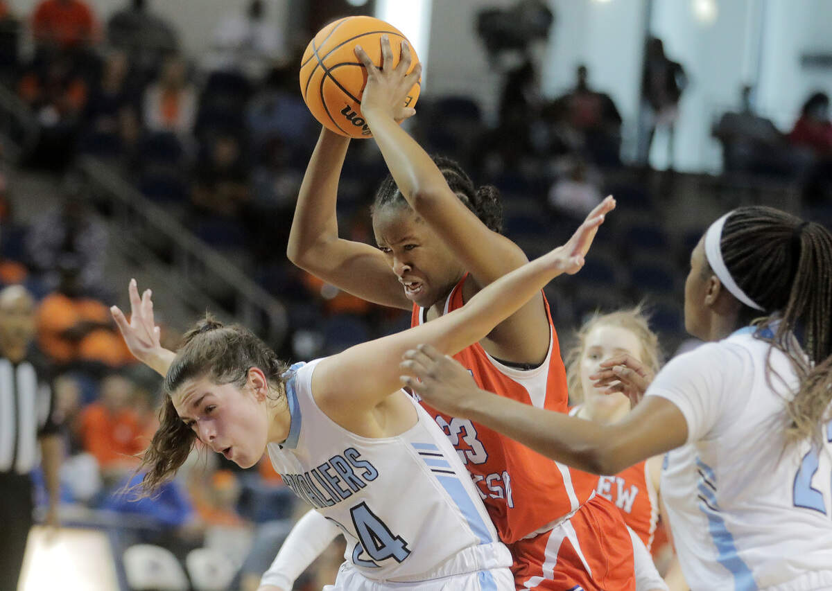 Andrew Jackon’s Tamia Watkins tries to shoot over Christ Church’s McCall King.