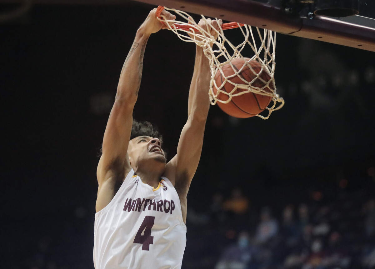 Winthrop’s Kelton Talford dunks the ball Thursday as the Eagles take on the UNC Bulldogs in Rock Hill.