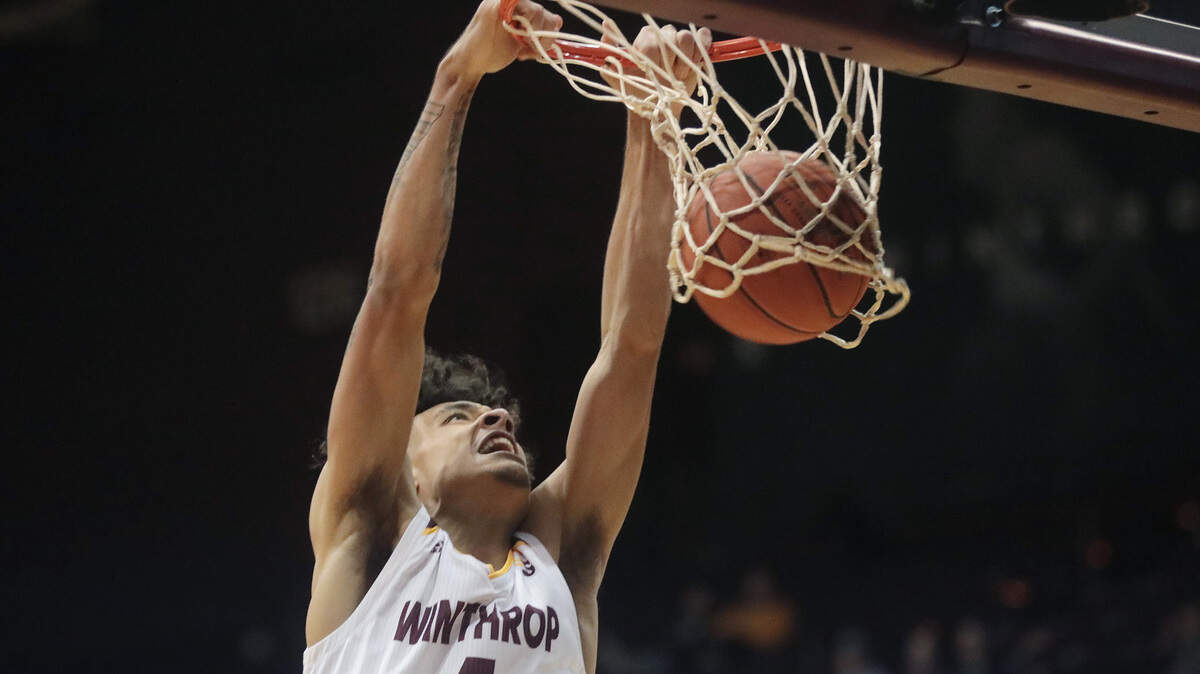 Winthrop’s Kelton Talford dunks the ball Thursday as the Eagles take on the UNC Bulldogs in Rock Hill.