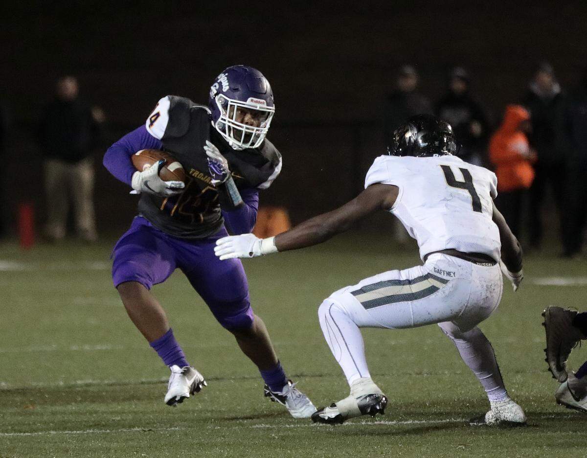 Northwestern’s Turbo Richard tries to avoid Gaffney’s Jesus Dowdle.
