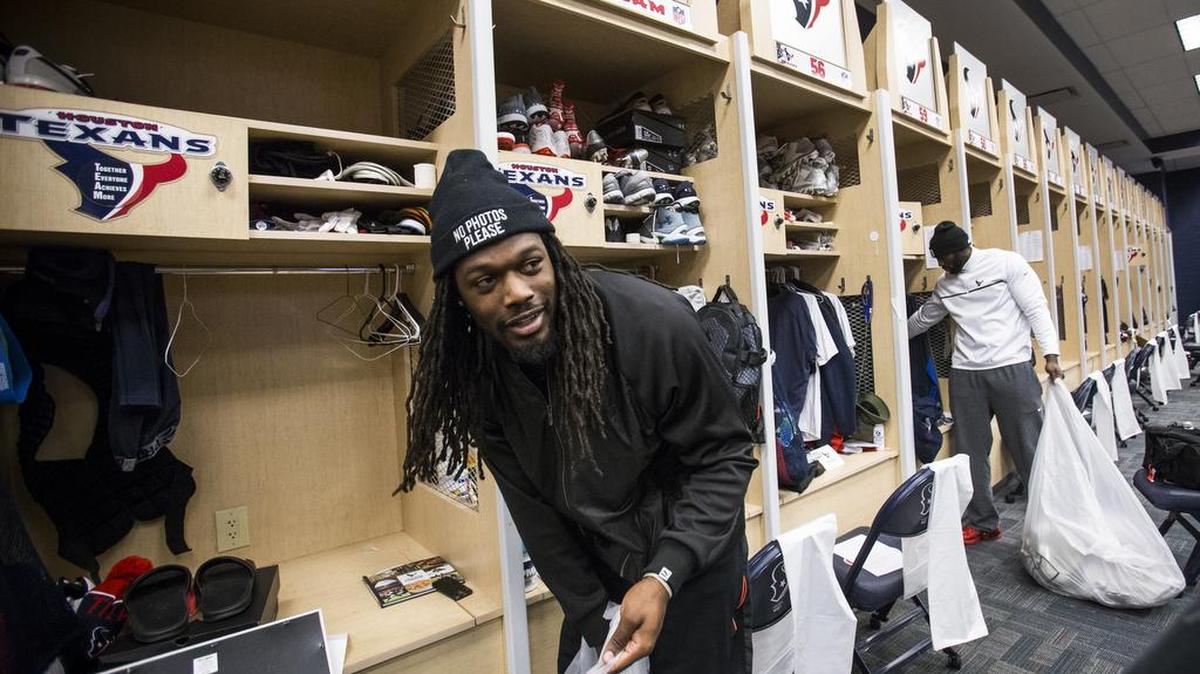 Houston Texans linebackers Jadeveon Clowney, left, and Whitney Mercilus clean out their lockers at NRG Stadium after being eliminated from the playoffs, Sunday, Jan. 10, 2016, in Houston.