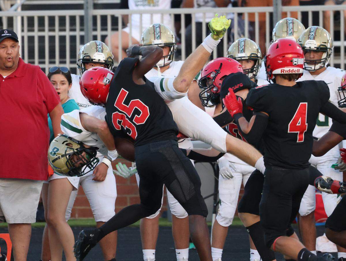 Nation Ford’s Antonio Crosby (35) flips Catawba Ridge’s Mason Boutwell during the first half of the game Friday, Sept. 1, 2023 in Fort Mill, S.C.