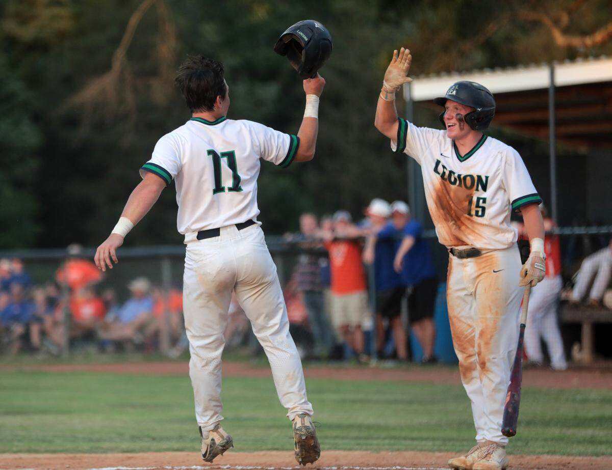 Legion’s Jack Killelea (11) and Ethan Belk celebrate after Killelea scores Friday in Chester.