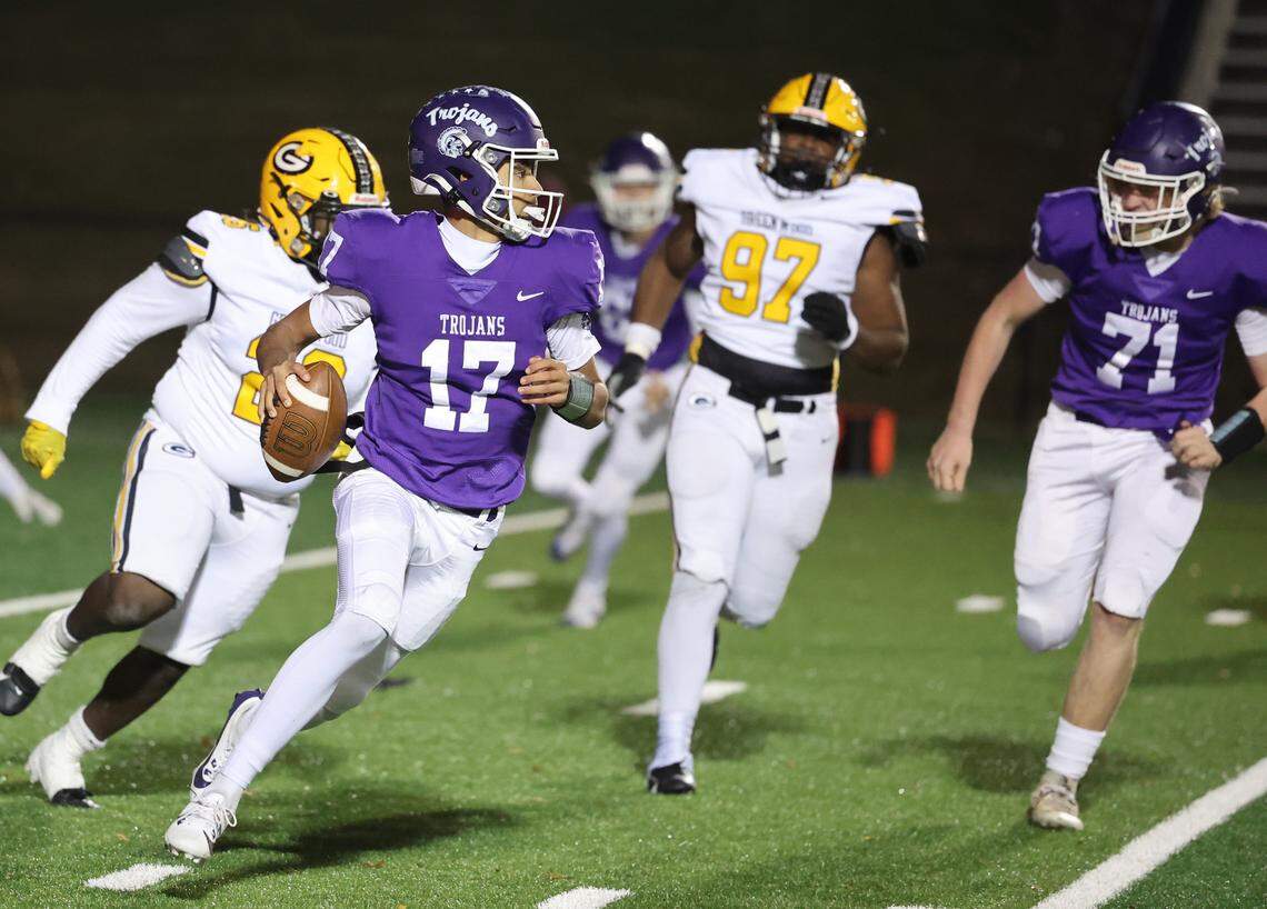 Northwestern’s Xavier Means (17) carries the ball Friday as the Northwestern Trojans take on the Greenwood Eagles in Rock Hill.