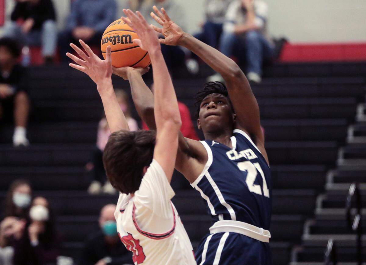 Clover’s Vincent Alexander puts up the shot around Nation Ford’s Caden Giles Friday as the Falcons and Blue Eagles compete in Fort Mill.