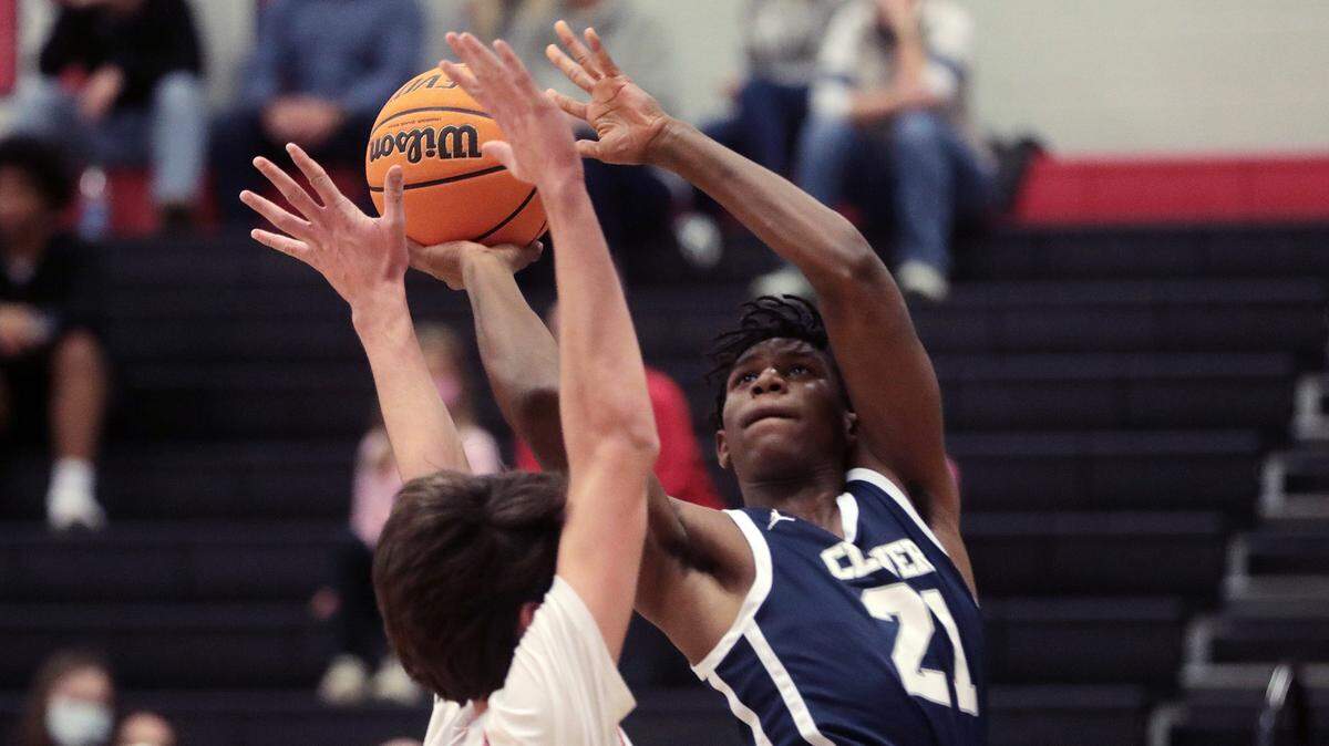 Clover’s Vincent Alexander puts up the shot around Nation Ford’s Caden Giles Friday as the Falcons and Blue Eagles compete in Fort Mill.