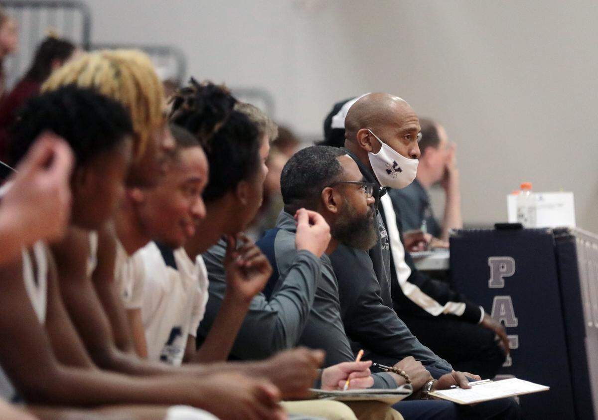 York Prep’s boys basketball coach Larry Davis, right, watches his team play against Buford High School on Friday.