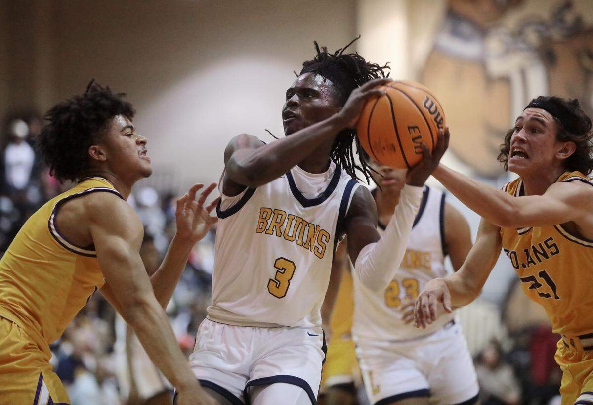 Northwestern’s Jalen Burnett, left, and Joey Tindale (21) put pressure on Lancaster’s Grayson Kirk.