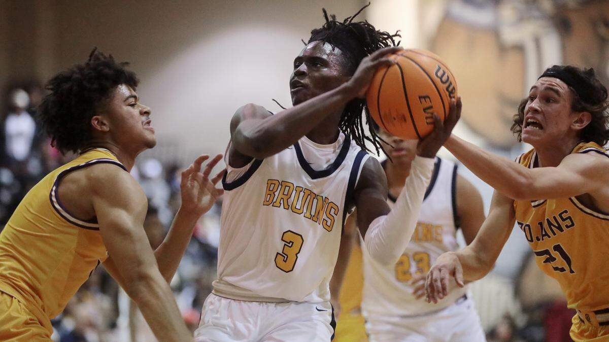 Northwestern’s Jalen Burnett, left, and Joey Tindale (21) put pressure on Lancaster’s Grayson Kirk.