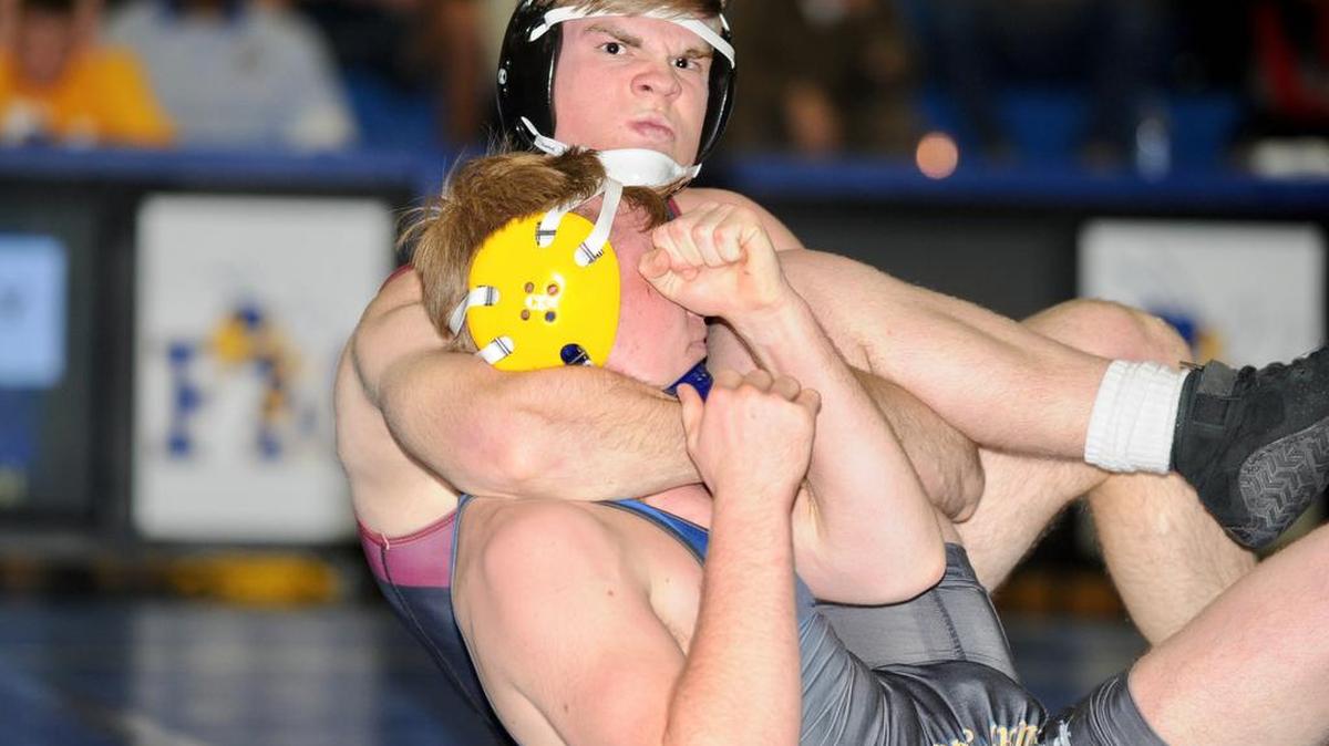 Rock Hill’s Noah Reynolds scored a quick pin at 170 to fully grab momentum for the Bearcats. They beat Fort Mill to advance to the 5A state title match Saturday.