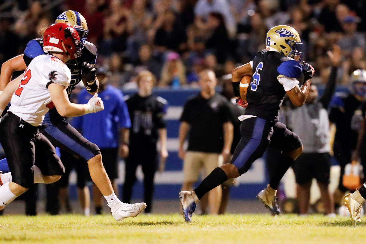 Indian Land’s #6 Miegwell Lewis carries the ball for the touchdown to start the game for the Warriors as Indian Land hosts Nation Ford.