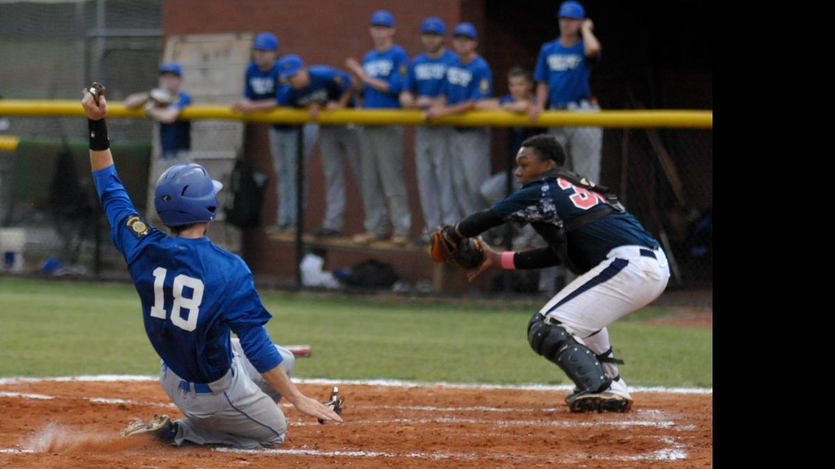 
Fort Mill American Legion Post 43's Justin Tepper slides home ahead of Rock Hill Post 34 catcher Devante Hayden, bringing the score to 5-0 Fort Mill in the third inning.
