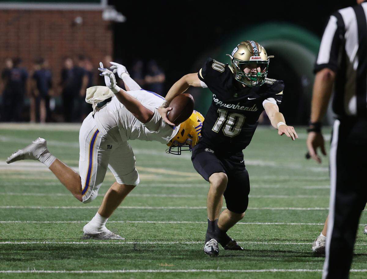 Catawba Ridge's Will Griggs carries the ball during Friday’s 14-10 win against Fort Mill.