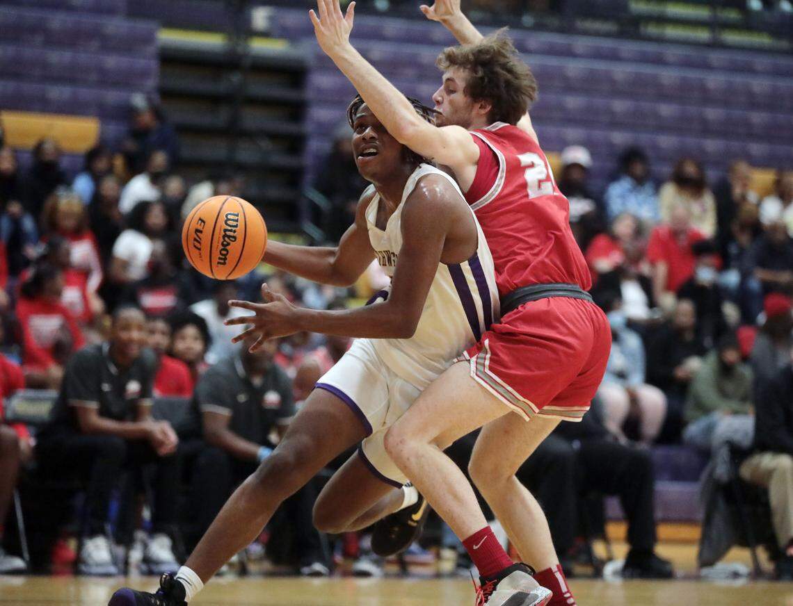 Northwestern’s Jayden Boyd heads to the basket against South Pointe’s Gage Russell.