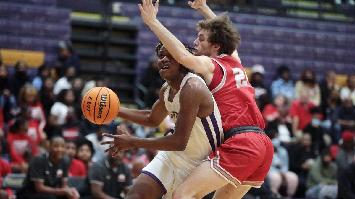 Northwestern’s Jayden Boyd heads to the basket against South Pointe’s Gage Russell.