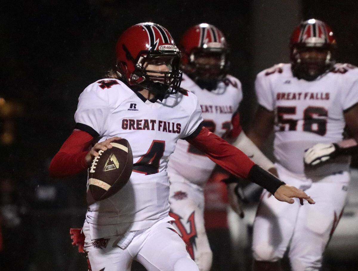 Great Falls quarterback Tommy Seagle looks for an opening Friday as the Devils compete with the Lewisville Lions in Richburg.