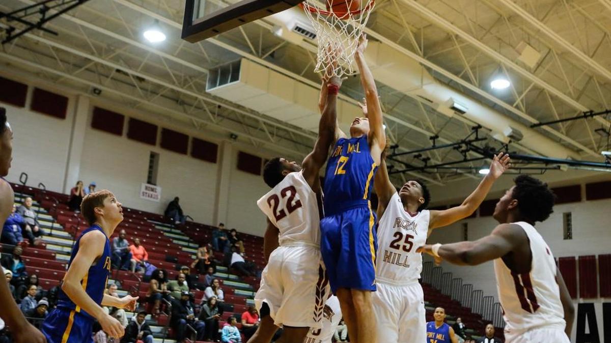 Fort Mill's No. 12 Keaton Griffin tries to tap in a rebound as Rock Hill hosts Fort Mill in boys varsity basketball Tuesday, 2-9-2016.