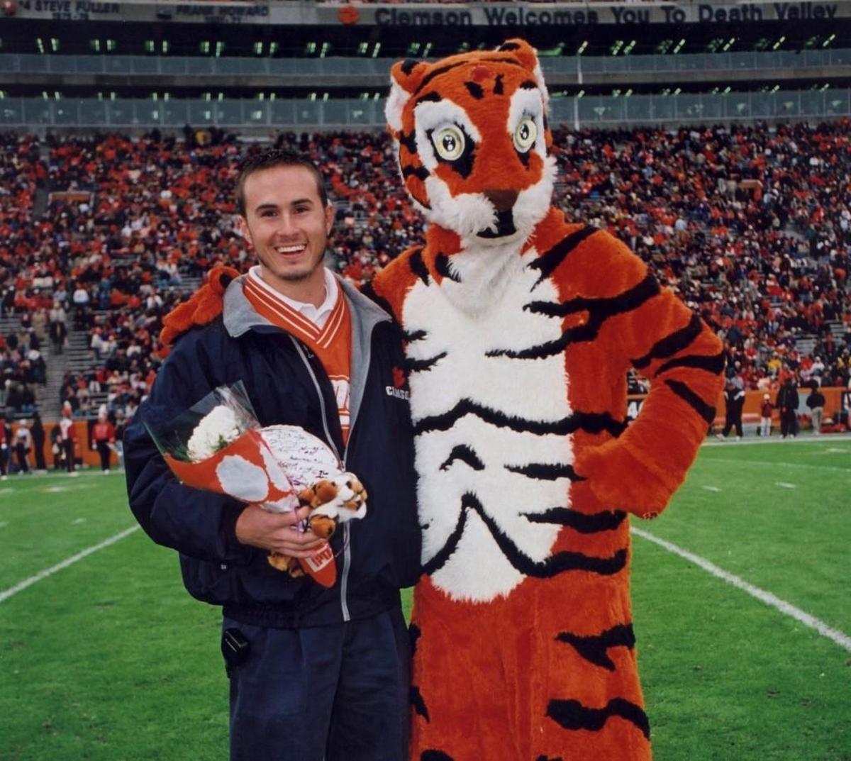 Brett Ringer with the Clemson Tiger mascot on Senior Day in 1998. Ringer passed away in 2001 but a scholarship program in his memory has raised over $100,000 in the 20 years since.