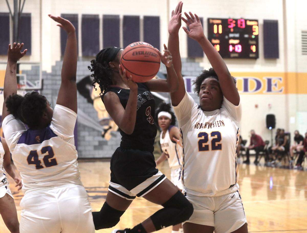 Rock Hill’s Laila Hankerson heads to the basket against Northwestern’s McKenzie Evans (22) and Jada Murphy (42).