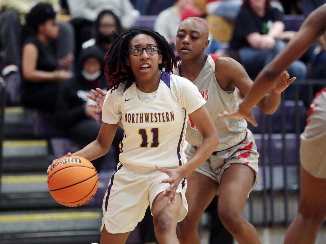 Northwestern’s Jazmin Mayberry heads to the basket followed by South Pointe’s Najah Lane.