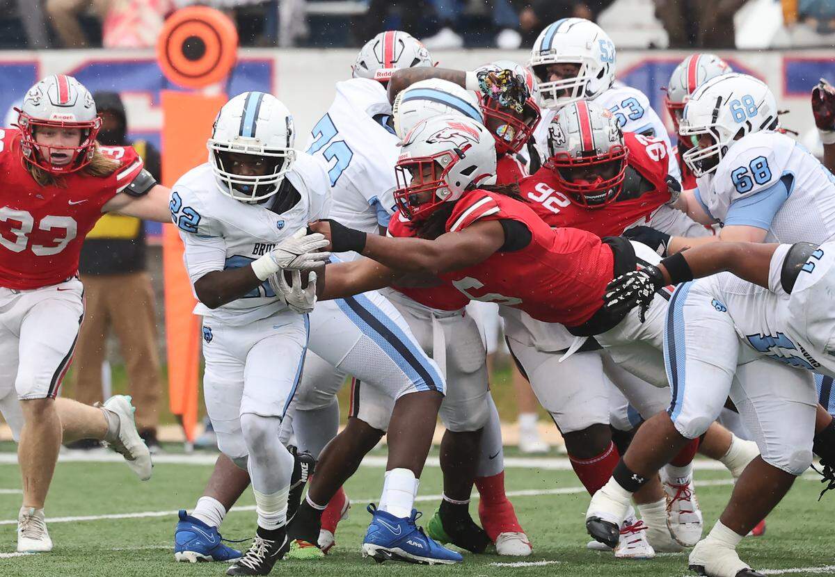 South Pointe's K.J. Burg  tries to tackle South Florence's Cameron James during the first half of the SC High School League Class 4A football championship
